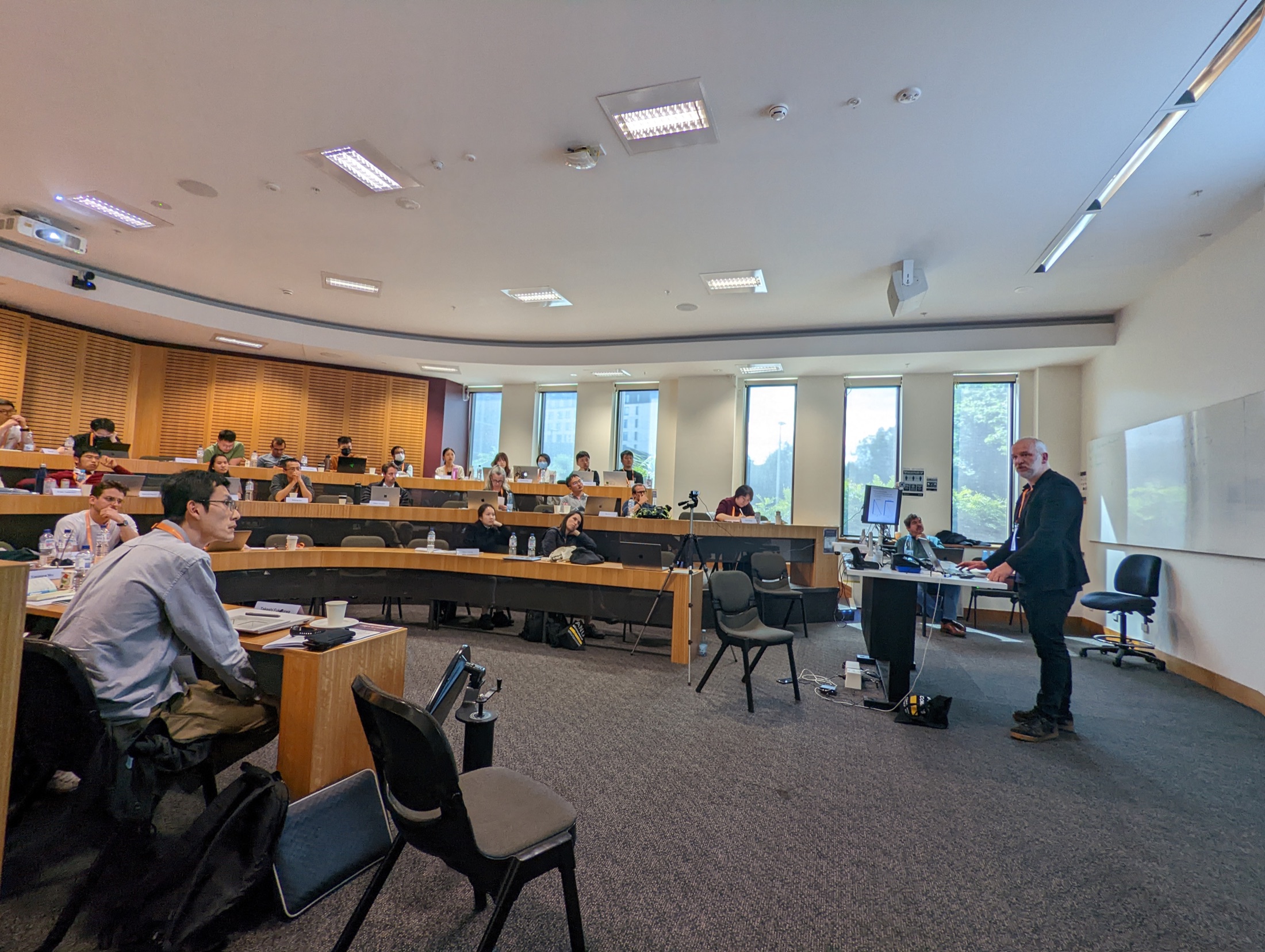 Bertel Schjerning presenting to participants in a university seminar room